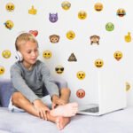 Emoji Wall Sticker Pack with a bed and child on bed