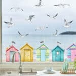 Seagulls and Beach Huts window stickers on a window with sea view