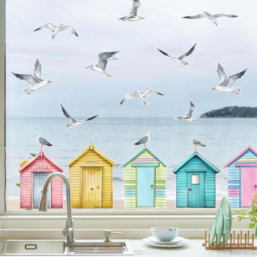Seagulls and Beach Huts window stickers on a window with sea view