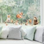 Woodland Animals Window Stickers on a living room window in front of a sofa