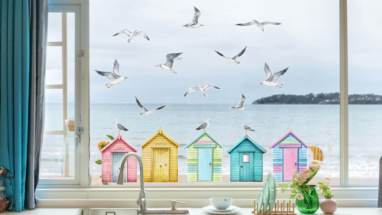 Seagulls and Beach Huts Window Stickers on a kitchen window in front of the sea